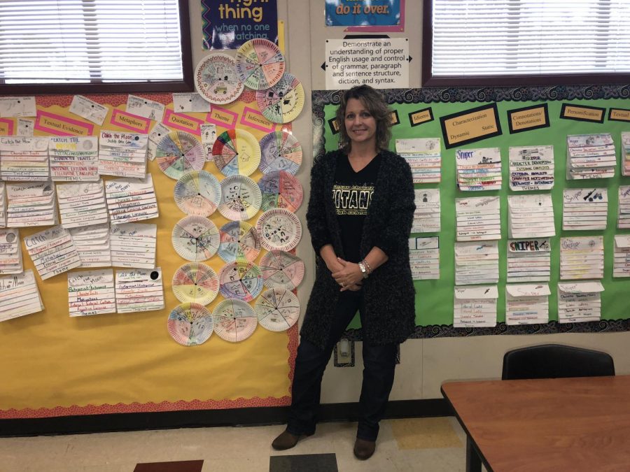 Kimberly Hughes proudly standing in front of her students excellent work wall. 