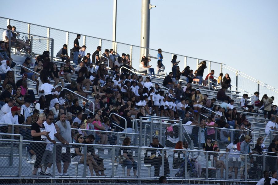 CCHS Students, parents and friends look on as the football team holds their annual team scrimmage to kick off fall sports. 