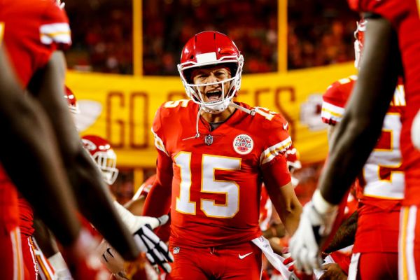 KANSAS CITY, MO - OCTOBER 21: Patrick Mahomes #15 of the Kansas City Chiefs runs through high fives from teammates during pre game introductions prior to the game against the Cincinnati Bengals at Arrowhead Stadium on October 21, 2018 in Kansas City, Kansas. (Photo by David Eulitt/Getty Images)
