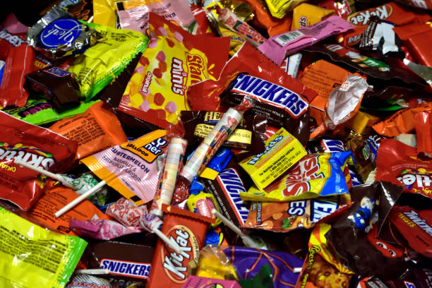 Detroit, Michigan, USA - October 31, 201: Large pile of mixed commercial candy from trick or treating on Halloween night.